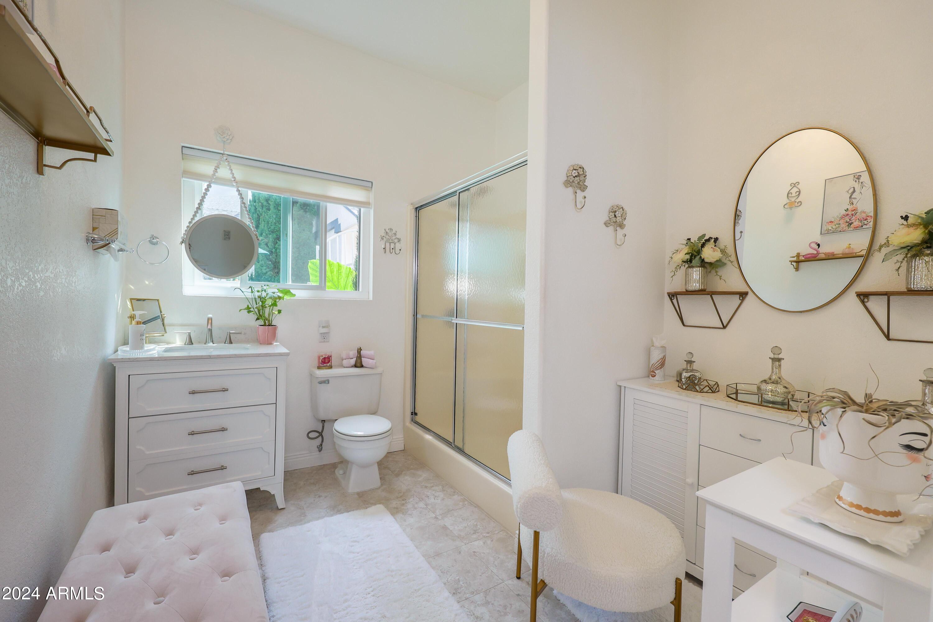 2204 North Maple Avenue Huachuca City, AZ 85616 - Photo 52 of 65 a bathroom with a toilet sink and mirror