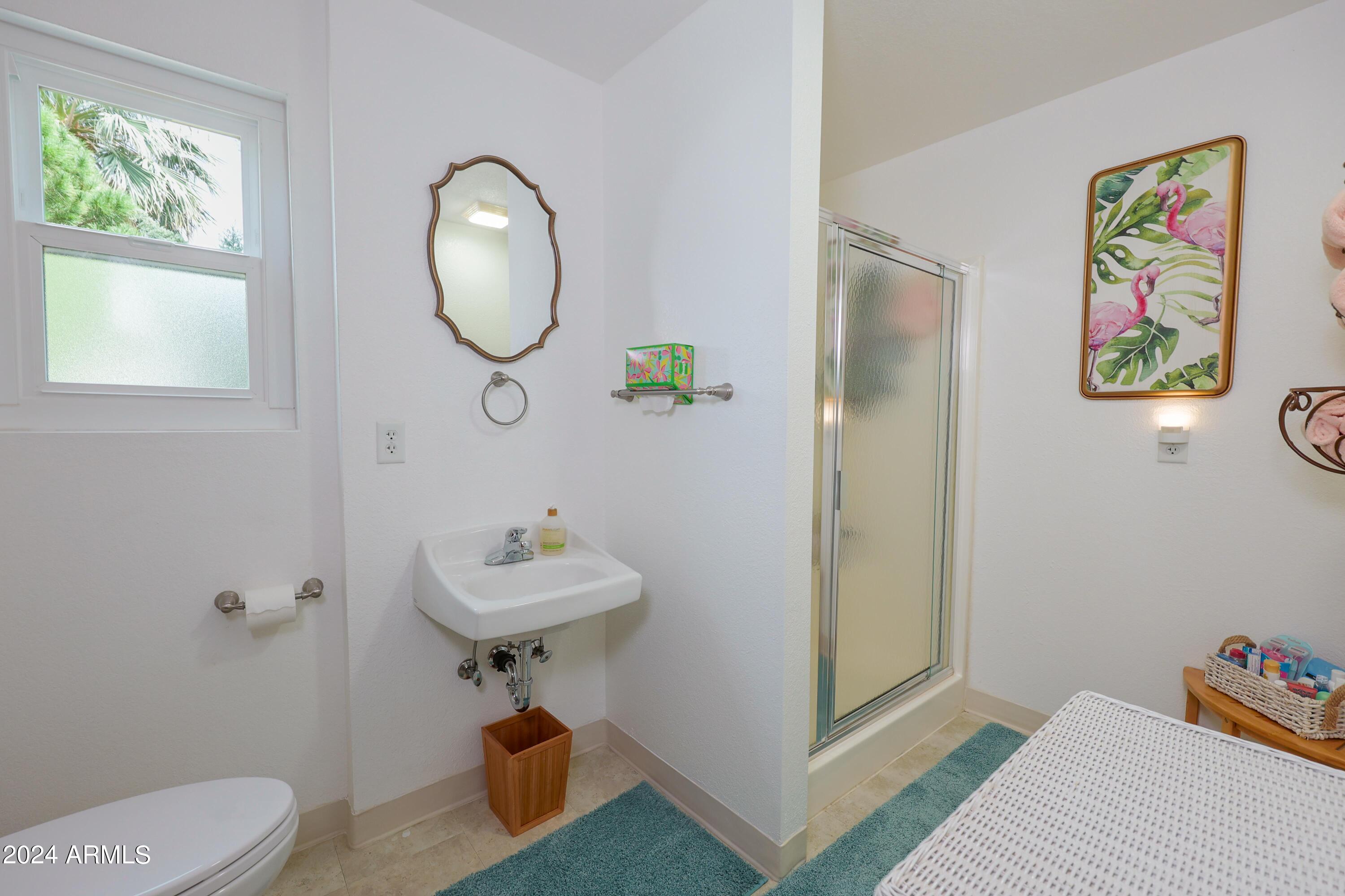 2204 North Maple Avenue Huachuca City, AZ 85616 - Photo 56 of 65 a bathroom with a sink mirror and toilet