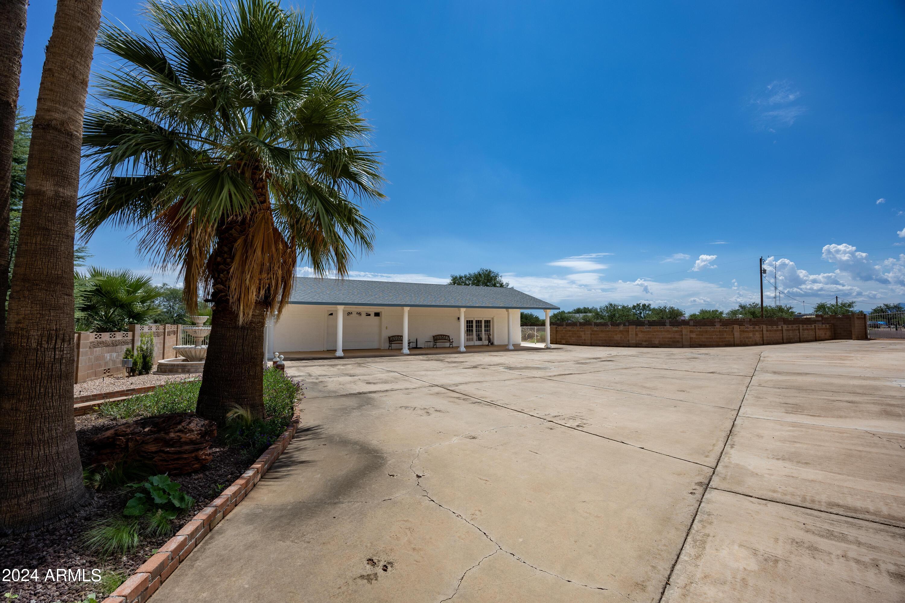 2204 North Maple Avenue Huachuca City, AZ 85616 - Photo 62 of 65 a front view of a house with a yard and garage