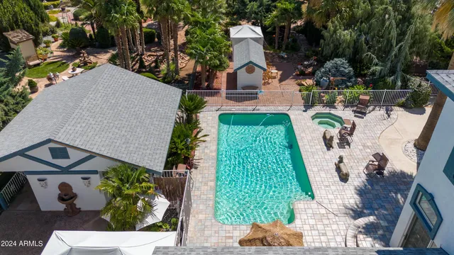 a view of a backyard with sitting area