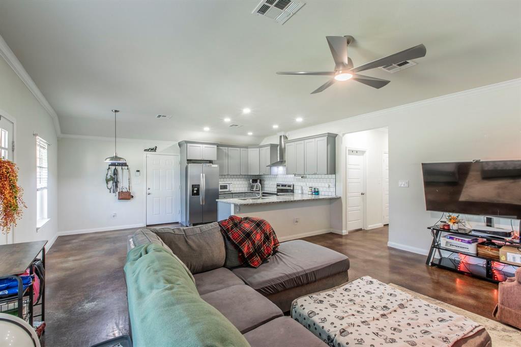 625 Delano Street Waco, TX 76704 - Photo 4 of 18 a living room with furniture and a flat screen tv