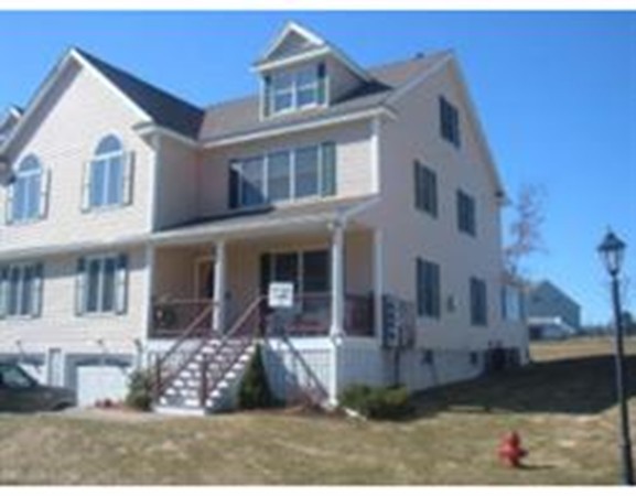 216 Rangeway Road, Unit 144 Billerica, MA 01862 - Photo 1 of 25 a view of a white house with large windows
