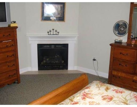216 Rangeway Road, Unit 144 Billerica, MA 01862 - Photo 16 of 25 a living room with furniture and a fireplace