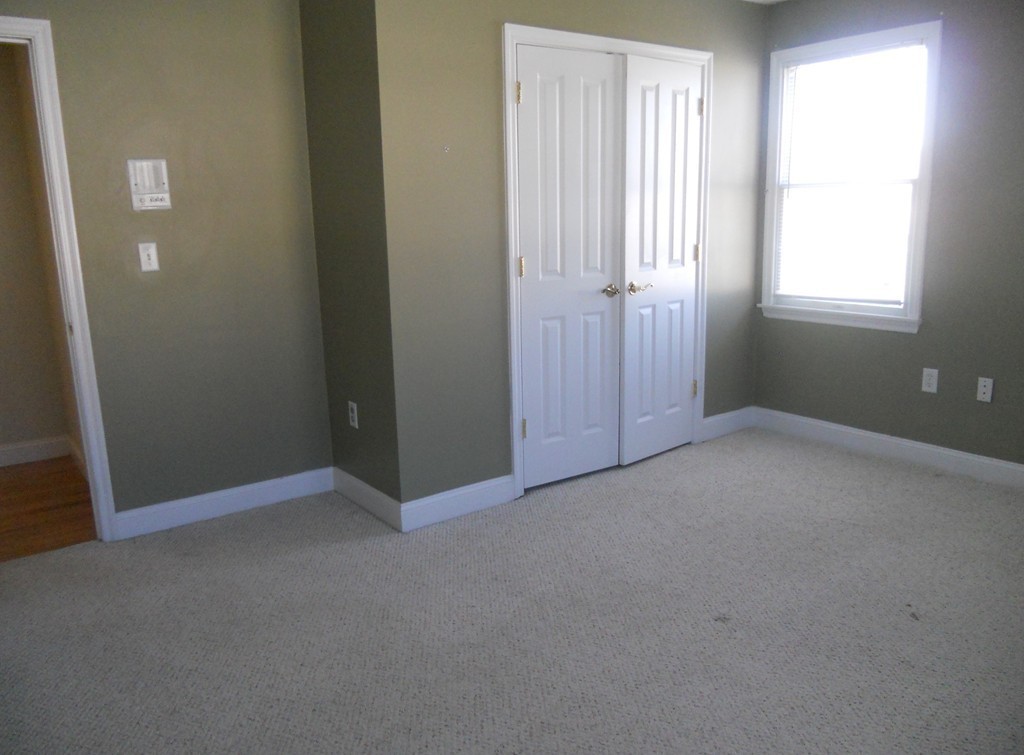 216 Rangeway Road, Unit 144 Billerica, MA 01862 - Photo 20 of 25 an empty room with windows