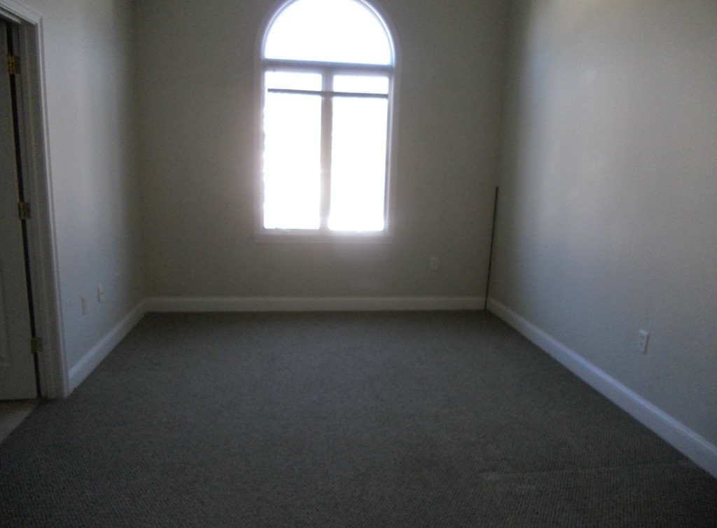 216 Rangeway Road, Unit 144 Billerica, MA 01862 - Photo 24 of 25 an empty room with a window