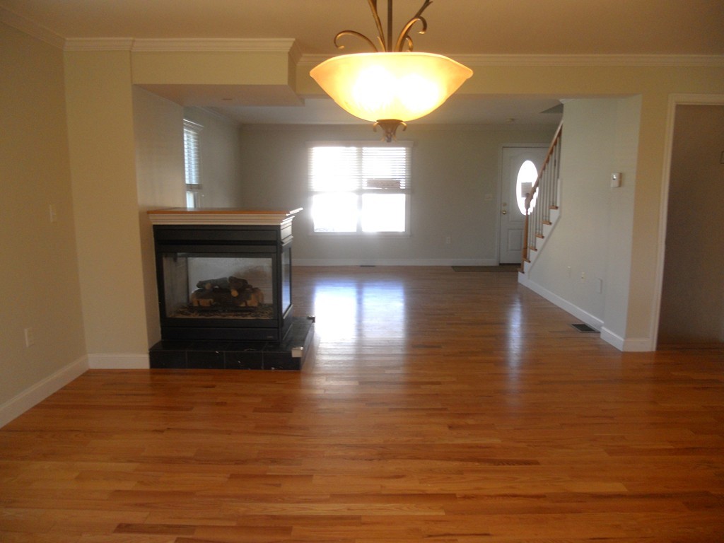 216 Rangeway Road, Unit 144 Billerica, MA 01862 - Photo 7 of 25 a view of a livingroom with a fireplace and window