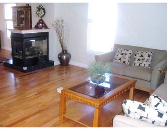 216 Rangeway Road, Unit 144 Billerica, MA 01862 - Photo 8 of 25 a living room with furniture and a fireplace