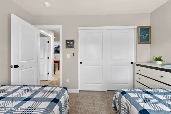 a bedroom with a bed and closet