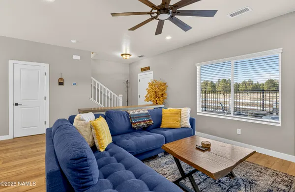 a living room with furniture and a window