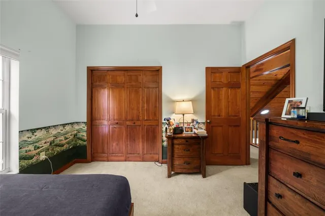 a bed room with a bed and a television