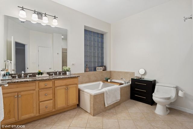 a bathroom with a bathtub sink and toilet