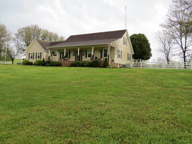 3286 Baugh Road Ardmore, TN 38449 - Photo 3 of 37 a view of a big house with a big yard and large trees