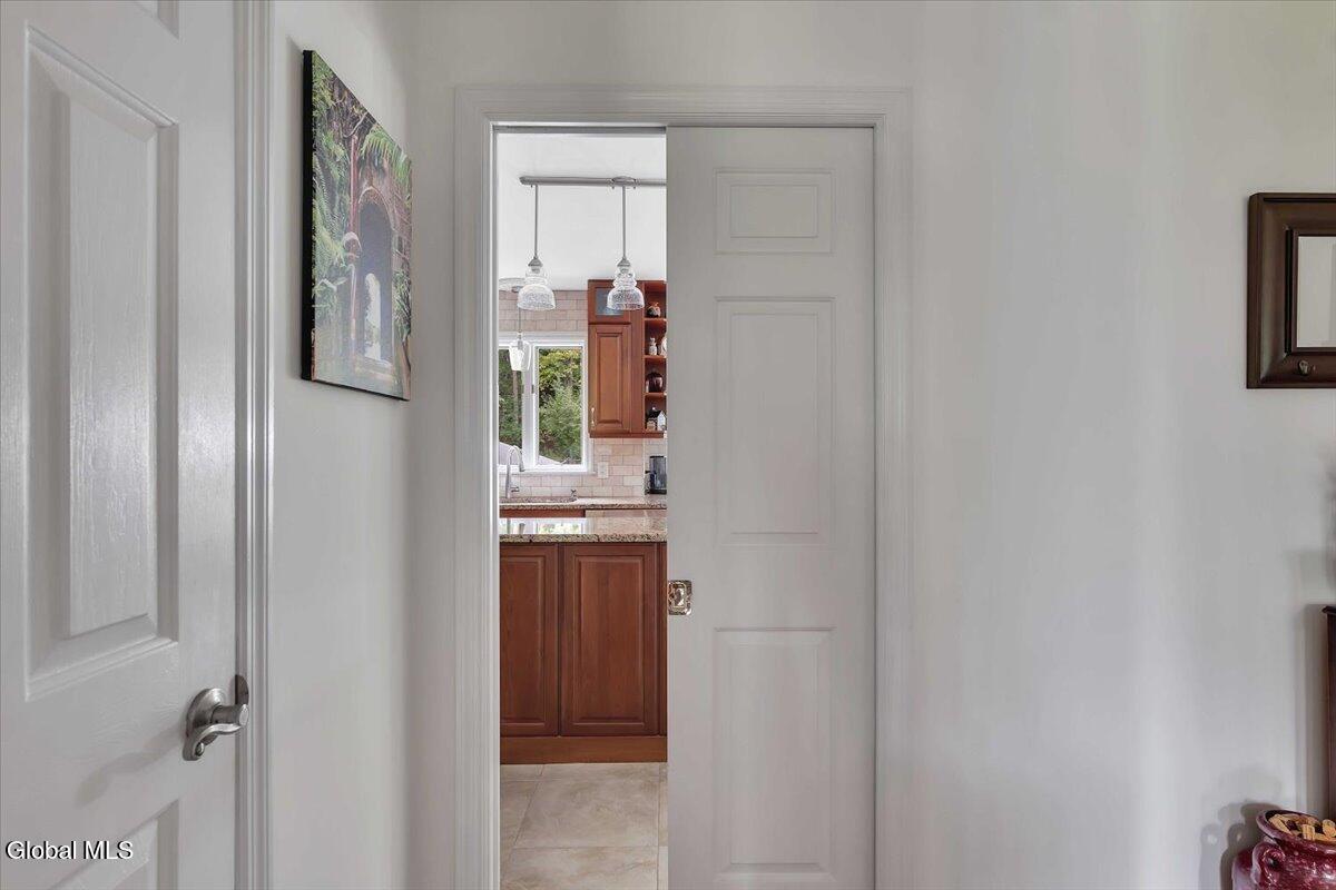 2124 Scotch Ridge Road Princetown, NY 12306 - Photo 17 of 62 1st Floor: Pocket Door to Kitchen