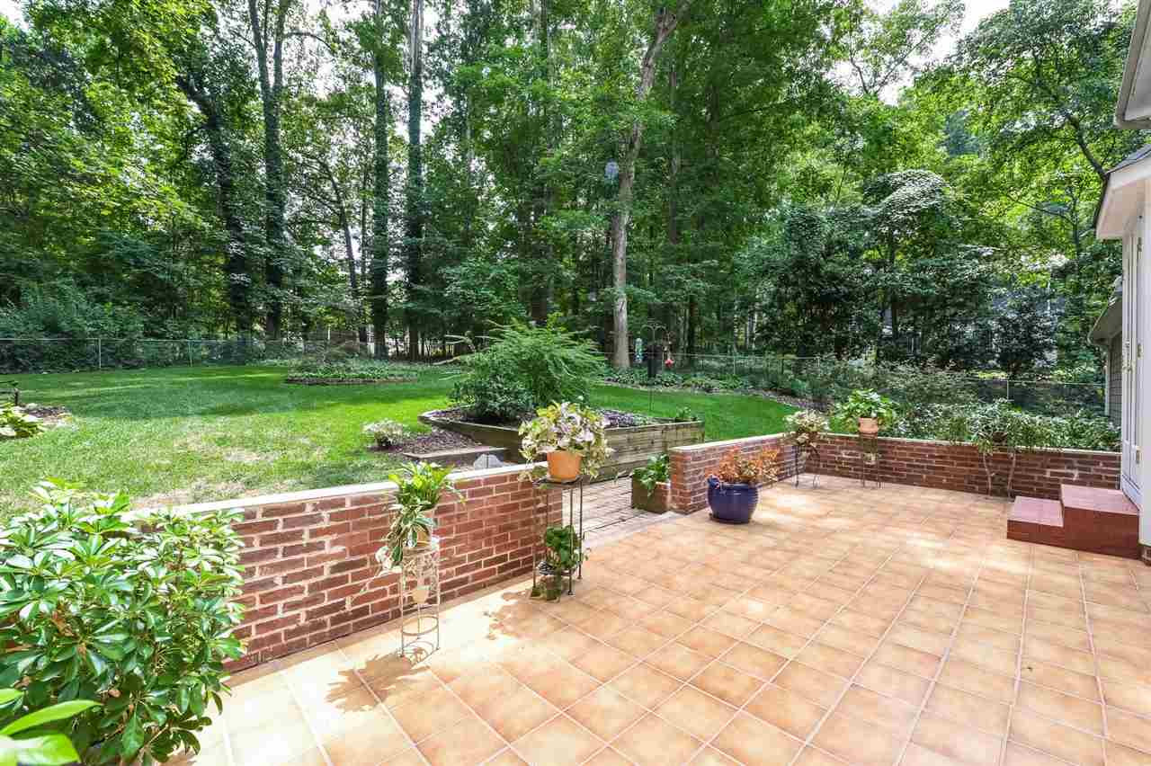 9716 Rock Creek Road Raleigh, NC 27613 - Photo 23 of 25 Tiled Patio with View of Extensive Backyard