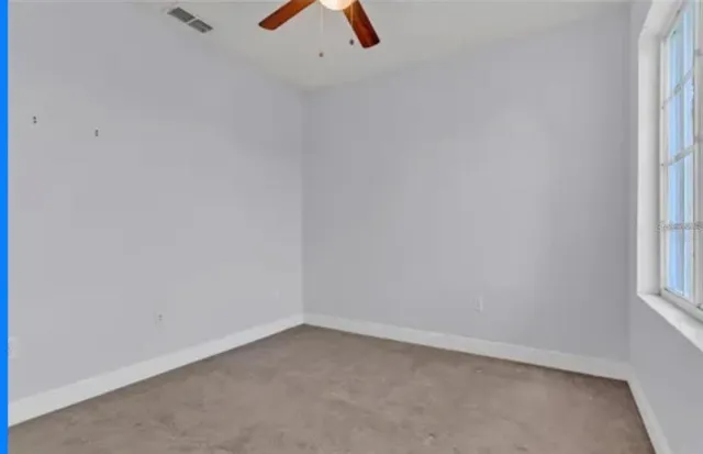 a view of a backyard with swimming pool