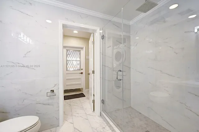 a bathroom with a shower and toilet