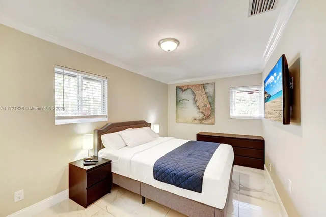 a bedroom with a bed and dresser