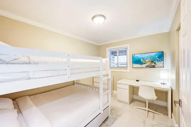 a bedroom with a bed and furniture