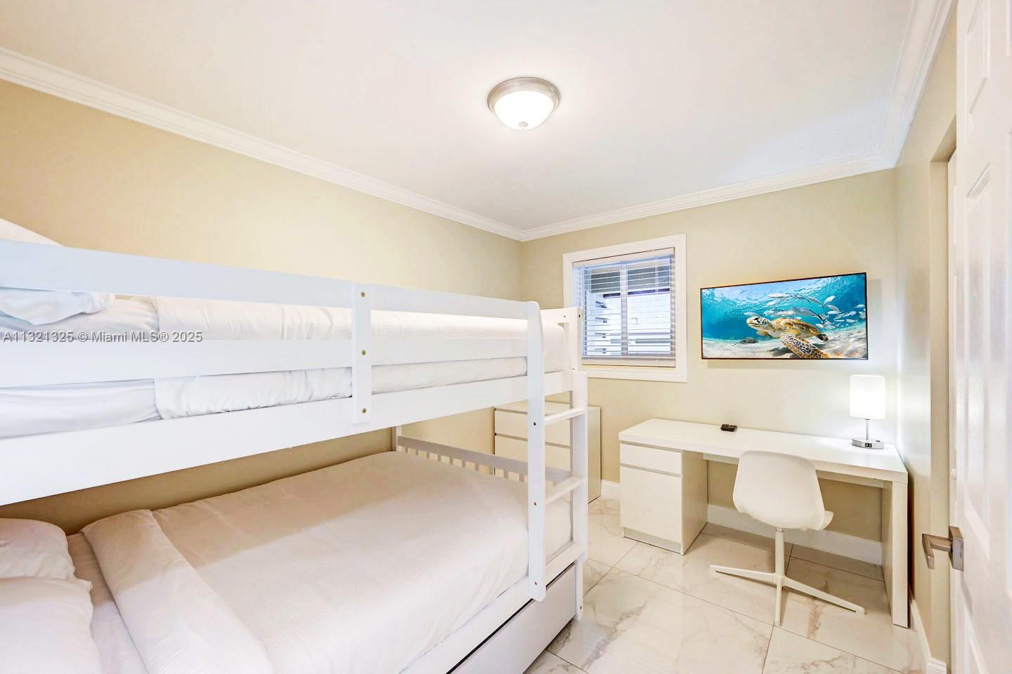 1020 North 13th Terrace Hollywood, FL 33019 - Photo 20 of 38 a bedroom with a bed and furniture