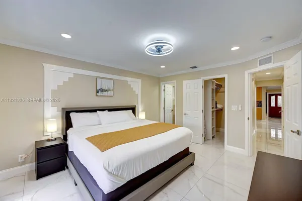 a bed room with a bed and a night stand