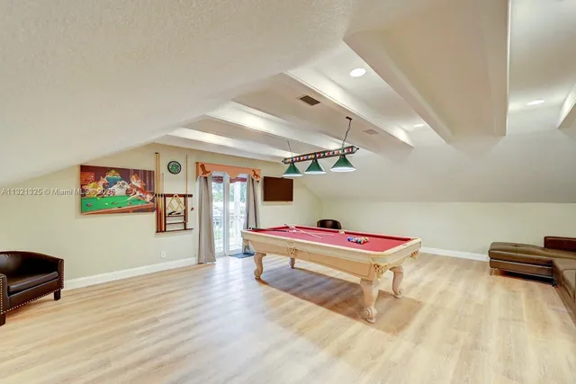 a room with furniture and wooden floor