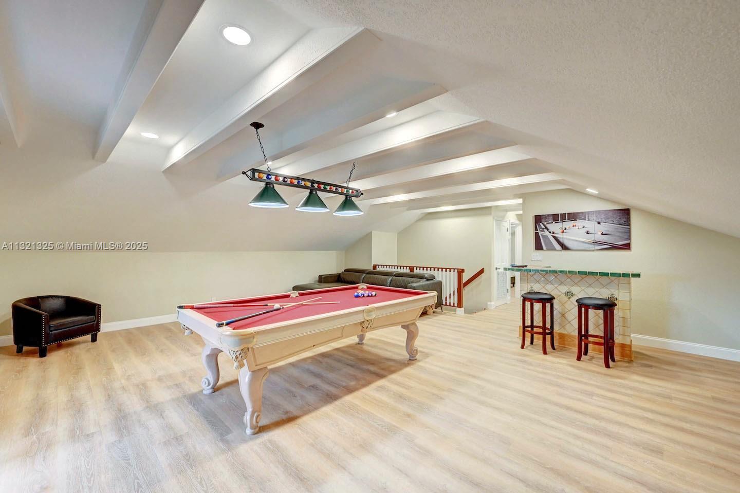 1020 North 13th Terrace Hollywood, FL 33019 - Photo 29 of 38 a room with furniture and a flat screen tv