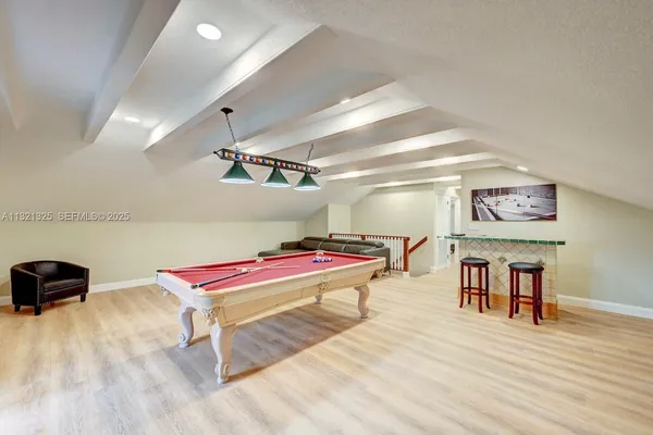 a room with furniture and a flat screen tv