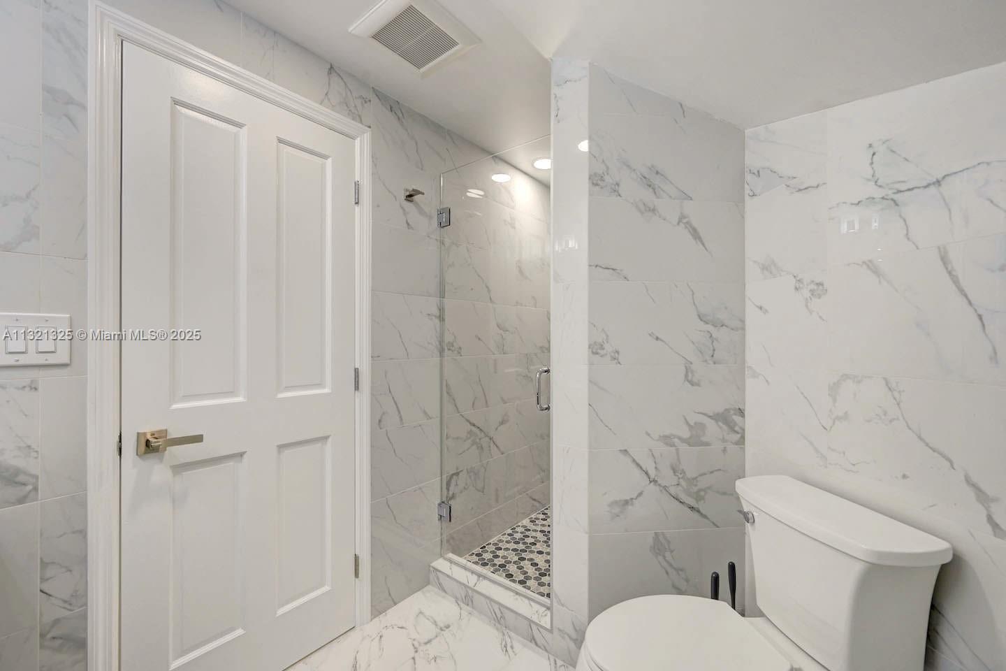 1020 North 13th Terrace Hollywood, FL 33019 - Photo 33 of 38 a bathroom with a toilet and shower