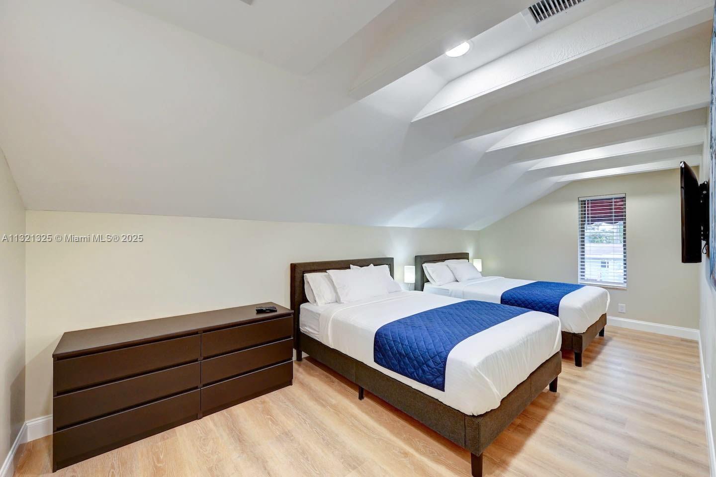 1020 North 13th Terrace Hollywood, FL 33019 - Photo 34 of 38 a bedroom with a bed and window