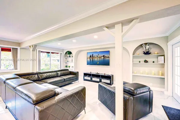 a kitchen with a refrigerator and a stove top oven