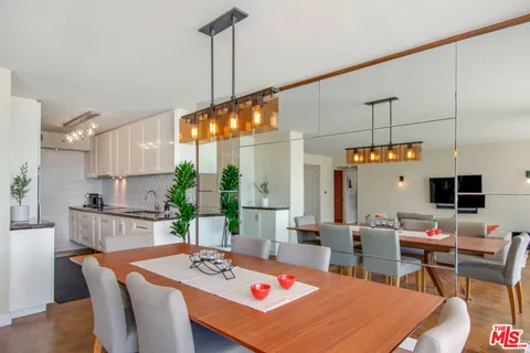 a bathroom with a glass shower door and a sink