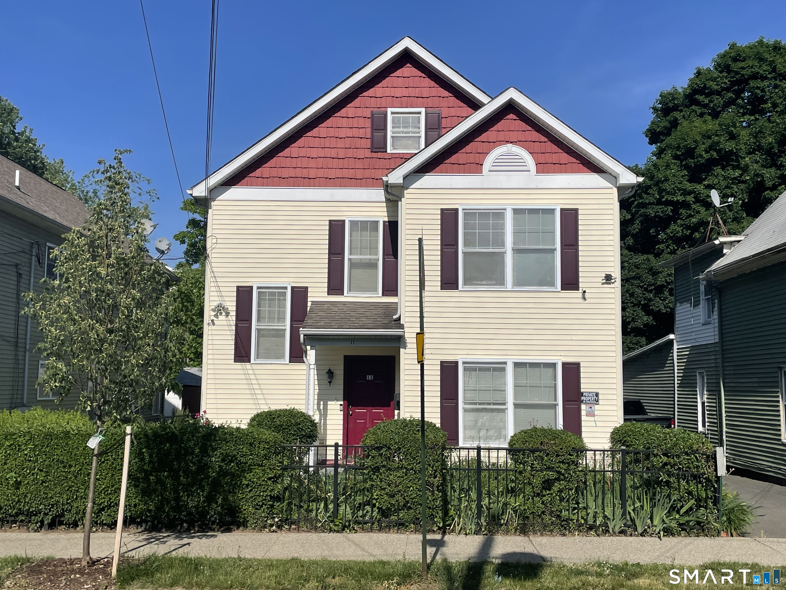 11 Button Street New Haven, CT 06519 - Photo 1 of 18 a front view of a house with yard and green space
