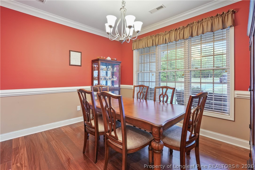 280 Hemp St Extension Robbins, NC 27325 - Photo 8 of 29 a view of a dining room with furniture window and wooden floor