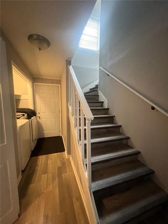312 Magnolia Avenue Thomaston, GA 30286 - Photo 19 of 40 a view of a hallway with wooden floor and staircase