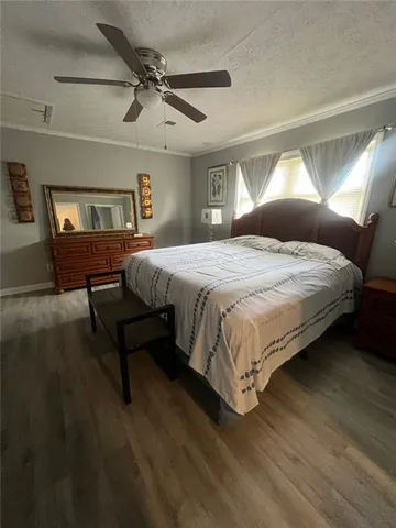a bedroom with a bed lamps and window