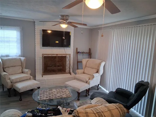 a living room with furniture and a fireplace