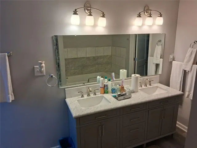 a bathroom with a sink and a mirror