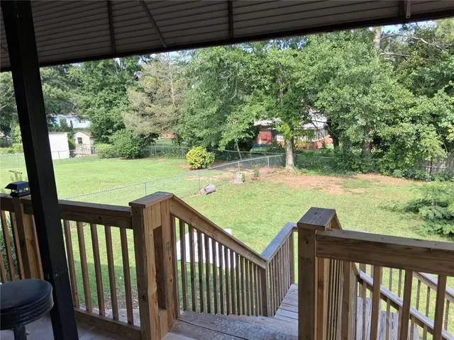 a view of a porch and garden