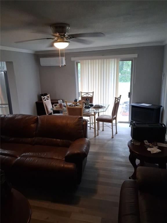 312 Magnolia Avenue Thomaston, GA 30286 - Photo 5 of 40 a living room with furniture and wooden floor