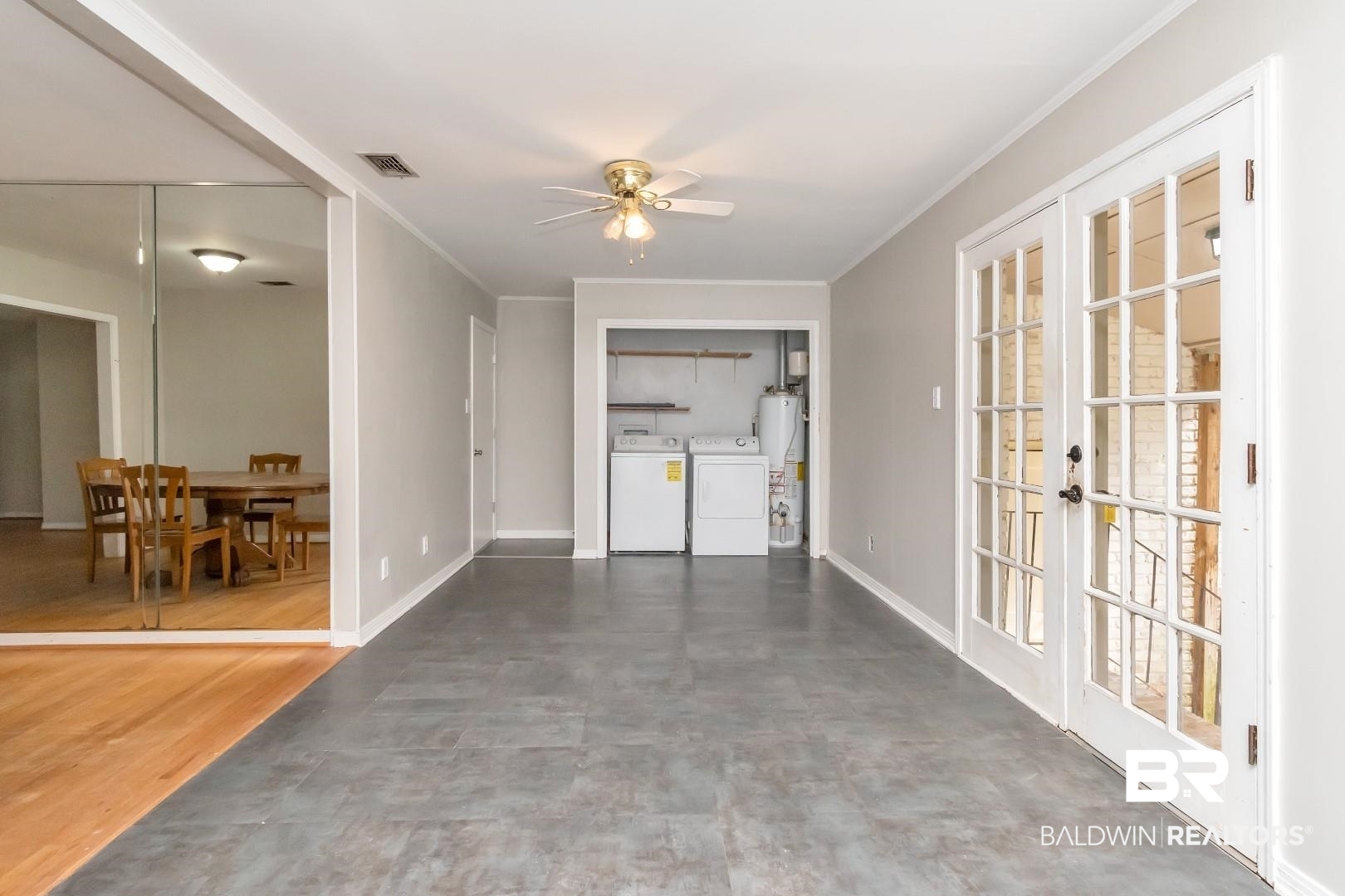320 Vanderbilt Drive Mobile, AL 36608 - Photo 13 of 39 Interior space with water heater, ceiling fan, washer and dryer, and french doors
