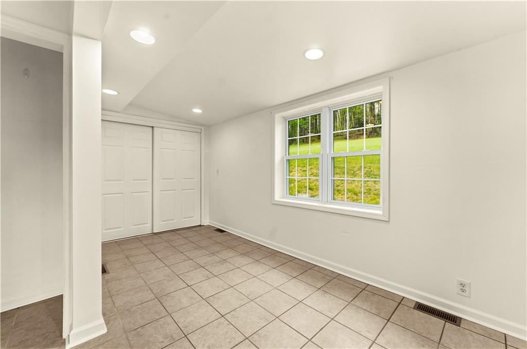 973 Blackhawk Road Beaver Falls, PA 15010 - Photo 13 of 36 an empty room with windows