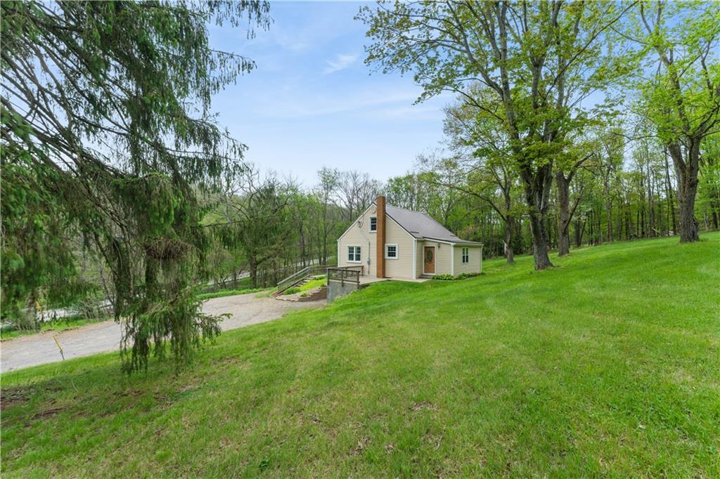 973 Blackhawk Road Beaver Falls, PA 15010 - Photo 35 of 36 a view of a house with a big yard and large trees