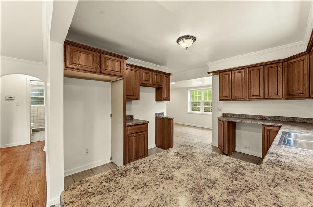 973 Blackhawk Road Beaver Falls, PA 15010 - Photo 8 of 36 a kitchen with granite countertop a refrigerator stove top oven and sink
