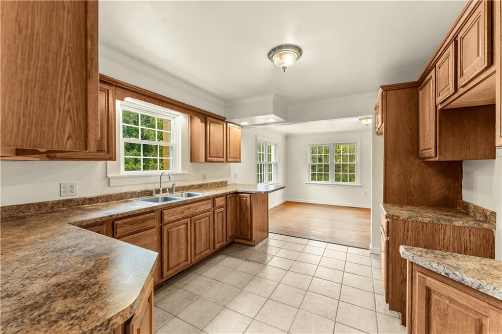 973 Blackhawk Road Beaver Falls, PA 15010 - Photo 10 of 36 a kitchen with stainless steel appliances granite countertop a stove sink and cabinets