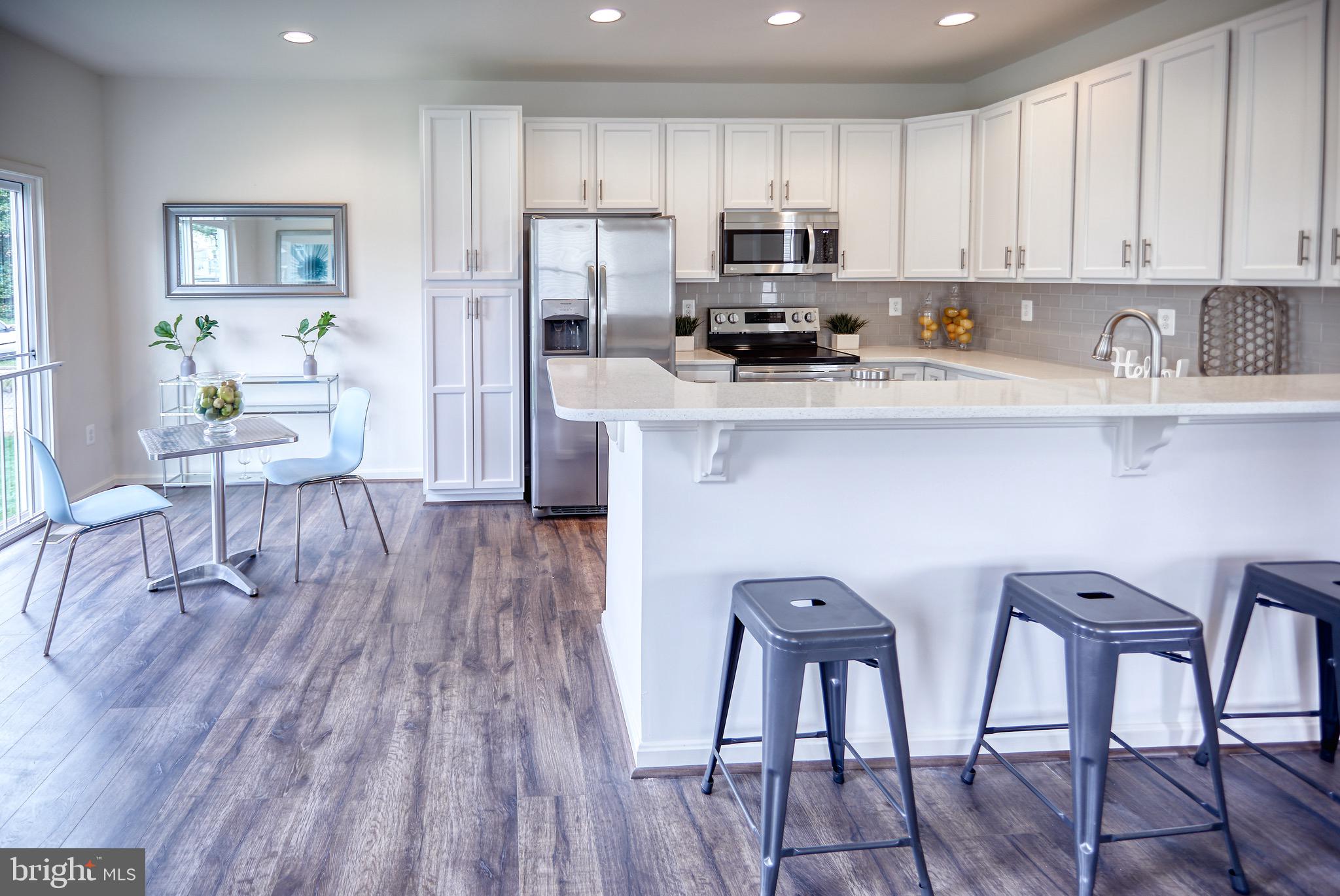 203 Patuxent Avenue Rosedale, MD 21237 - Photo 6 of 32 Kitchen with breakfast bar and Sunroom