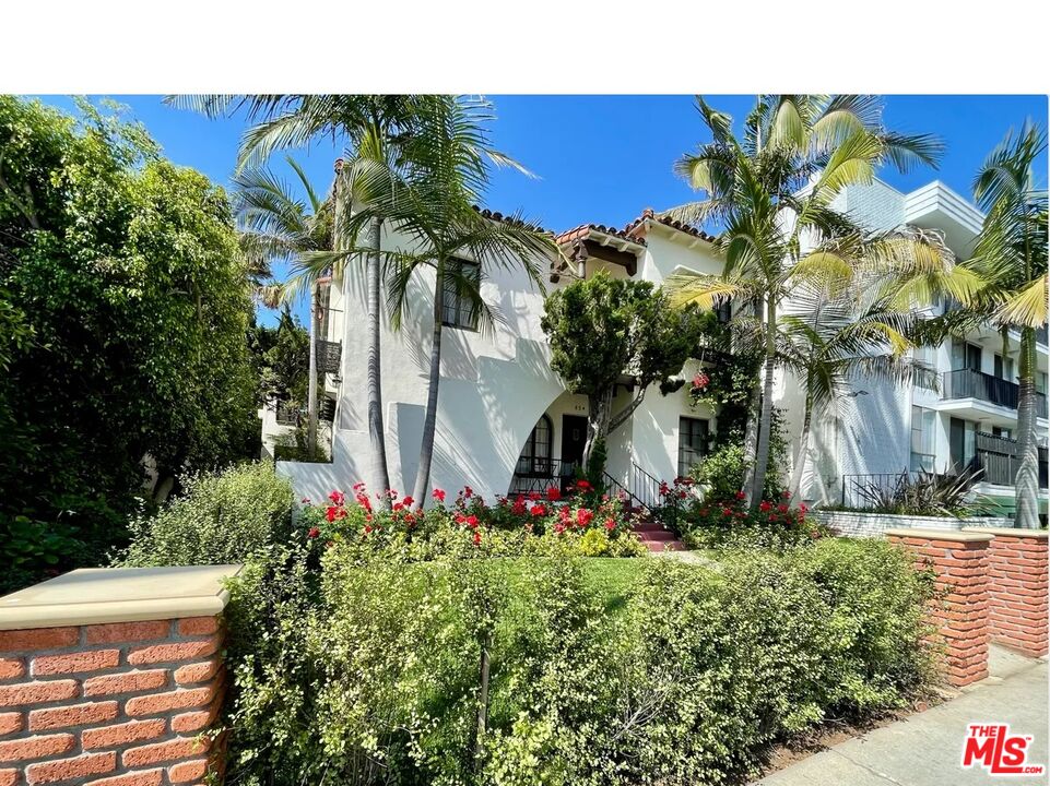 854 4th Street, Unit F Santa Monica, CA 90403 - Photo 1 of 13 a view of a house with a yard and potted plants