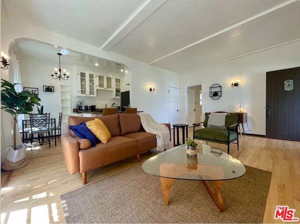 854 4th Street, Unit F Santa Monica, CA 90403 - Photo 7 of 13 a living room with furniture and wooden floor