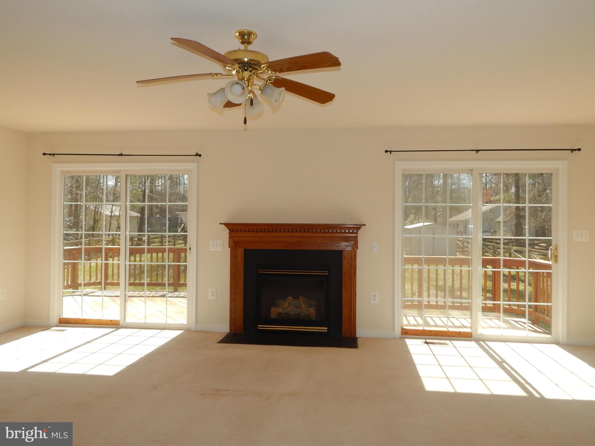 Family Room with Fireplace, French Doors to Deck