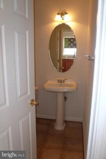 8115 Hard Shale Road Manassas, VA 20111 - Photo 14 of 26 Main Level Powder Room with Pedestal Sink