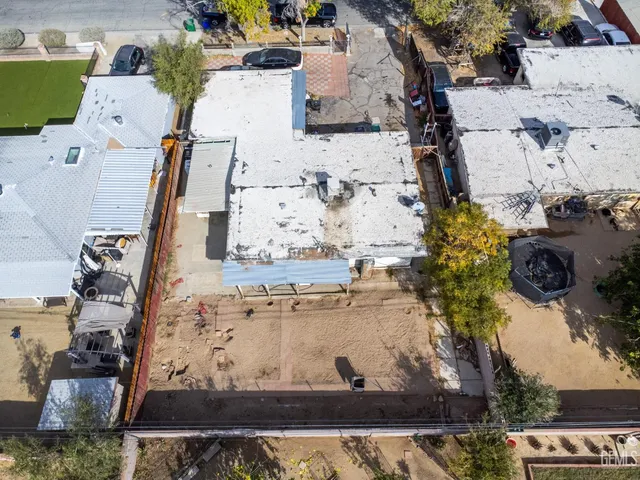 an aerial view of a residential houses with outdoor space